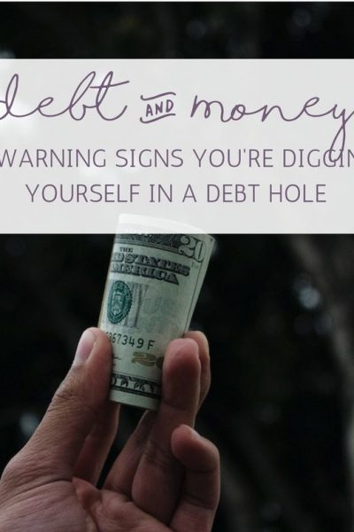 4 WARNING SIGNS YOURE DIGGING YOURSELF IN A DEBT HOLE